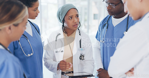 Image of Doctor, people and tablet in meeting, surgery planning or treatment feedback in Islamic research hospital. Talking, diversity and healthcare nurses on technology, teamwork or leadership collaboration