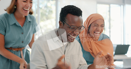 Image of Success, good news and team in celebration in the office for achievement, teamwork or goal on laptop. Diversity, celebrate and happy business people celebrating successful collaboration in workplace.