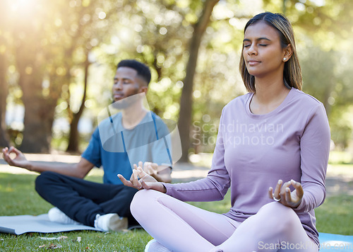 Image of Mediation, peace and yoga class with people in park for relax, mindfulness and spirituality. Zen, fitness and wellness with black man and woman and training in nature for health, healing or gratitude
