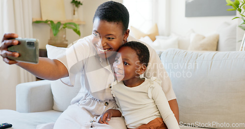 Image of Smartphone, selfie and mother with child on living room sofa for social media post, parents blog update or family home celebration. Black family smile in cellphone portrait photography for online app