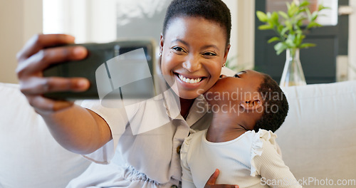 Image of Smartphone, selfie and mother with child on living room sofa for social media post, parents blog update or family home celebration. Black family smile in cellphone portrait photography for online app