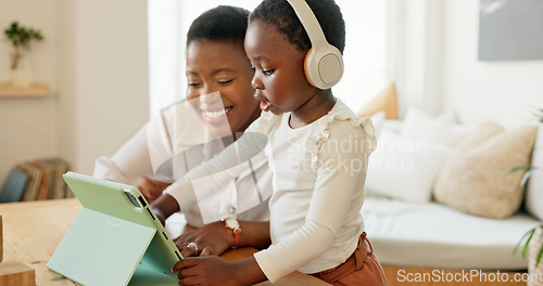 Image of Tablet, black mother and girl on video call, being happy and wave with smile in living room at home. Mama, child and daughter with digital device for connect, smile and bonding to blow kiss in lounge