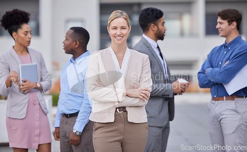 Image of Business people, leadership and portrait of woman outside office with smile and confidence on break from work. Manager, ceo and lady boss with employees networking and b2b with human resources team.