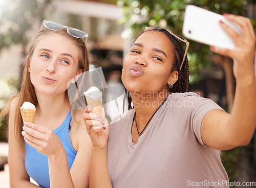 Image of Friends with ice cream, kiss and selfie outdoor with travel, happy with dessert and spending time together on vacation. Social media post, pout face in picture and young female eating gelato in Italy