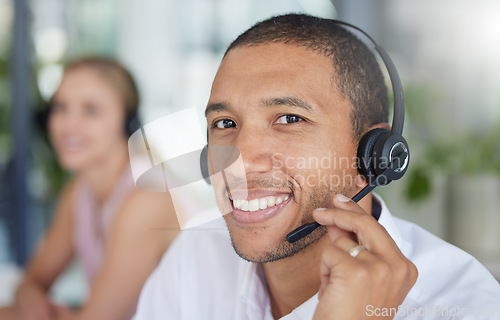 Image of Smile, headset and portrait of a man in a call center for online support, consulting and advice. Happy, conversation and face of a customer service agent working in telemarketing, sales and helpline