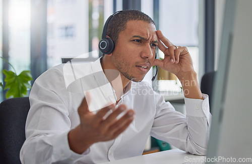 Image of Confused, stress or frustrated black man in call center angry with 404 error at customer services help desk. Doubt, faq or mad sales consultant with mistakes or problems in a telemarketing company