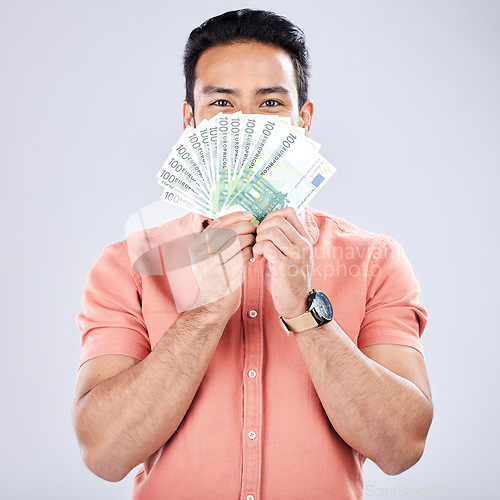 Image of Asian man, portrait or money fan on studio background for financial freedom, stock market profit or investment. Winner, cash or euro for happy investor for finance success, savings or isolated growth