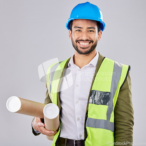 Image of Portrait, engineering or happy man in studio with blueprint or smile planning a real estate building. Designer, architecture or contractor with vision of renovation business in project management