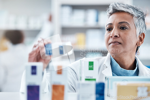 Image of Elderly woman, pharmacist and check with box, medicine or pills by shelf in store for healthcare services. Senior pharma expert, retail stock and medical product for mockup space, health and wellness