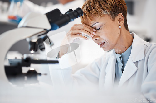 Image of Scientist with headache, tired and overworked, woman and burnout with pain, deadline and overtime. Medical research, scientific stress and senior female in science, fatigue and overwhelmed in lab