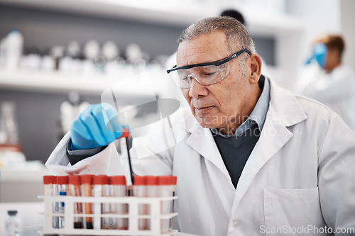 Image of Blood, science and scientist in laboratory with sample for research, medical study and forensic investigation. Healthcare, pharmaceutical and senior man with vial for dna test, exam and rna analysis