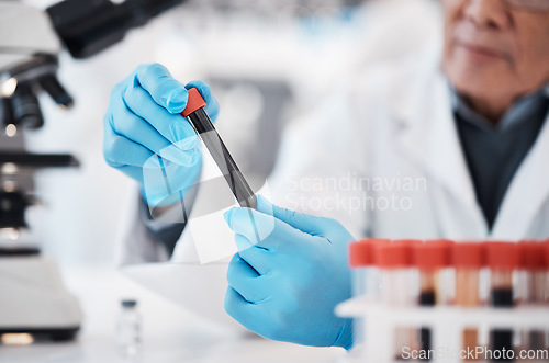 Image of Blood, test tube and hands of scientist in laboratory with sample for research, medical study and investigation. Healthcare, pharmaceutical and man with vial for dna testing, science and rna analysis