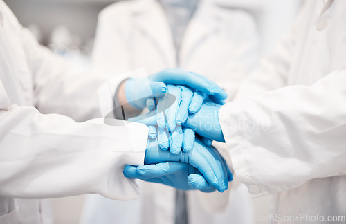 Image of Doctor, team and hands together with gloves in healthcare, partnership or trust for collaboration, unity or support at lab. Group of medical experts piling hand in teamwork for motivation or safety