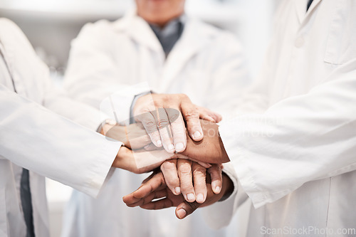 Image of Doctor, team and hands together in healthcare, partnership or trust for collaboration, unity or support at lab. Group of medical experts piling hand in teamwork for motivation, cooperation or union