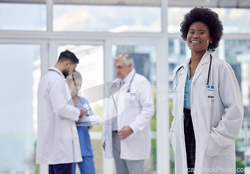 Image of Black woman, portrait or doctor in hospital leadership, about us or medical collaboration for clinic medicine, trust or life insurance. Smile, happy or healthcare worker in diversity teamwork or help