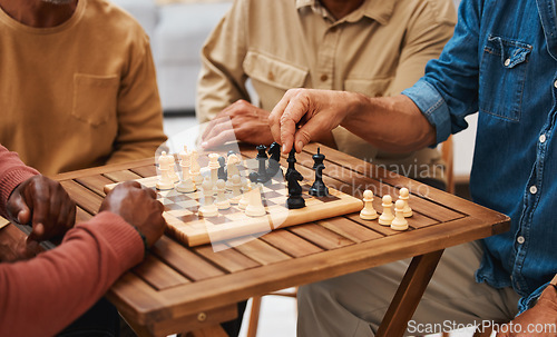 Image of Hands, chess and friends in board games on wooden table for strategic competition, tactical move or decision. Hand of skilled strategy player holding black bishop playing game with friend in tactics
