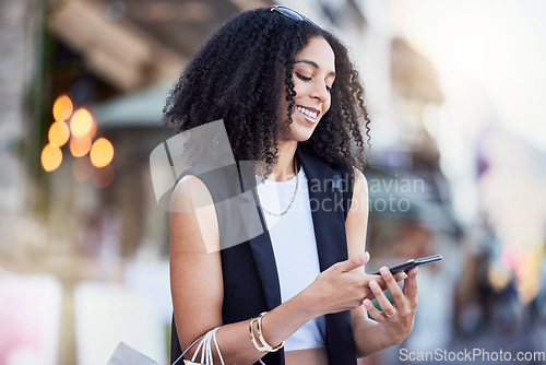 Image of Black woman, smartphone and texting in city with shopping, online date and social network app for contact. Happy gen z girl, phone and internet communication with digital ux, chat and walk in street