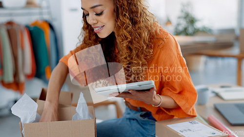 Image of Tablet, logistics and fashion manager with a checklist in retail store clothes or clothing boxes inspection. Entrepreneur, shopping and small business owner writing stock delivery for quality control