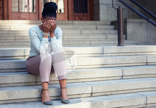 Image of Stress, crying and black woman on steps with anxiety, panic attack or mental health problem. Corporate, pressure and lady with headache outside of office building, worry or mistake, fail or crisis