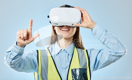 Image of Employee, virtual reality glasses and pointing with woman, development and online planning against a blue studio background. Vr, female technician and engineer with metaverse, networking and success