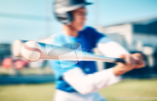Image of Baseball, game and man with training, speed and outdoor for exercise, blurry and wellness. Male athlete, guy and athlete with bat, health and hit a fast ball, practice and routine on field or workout
