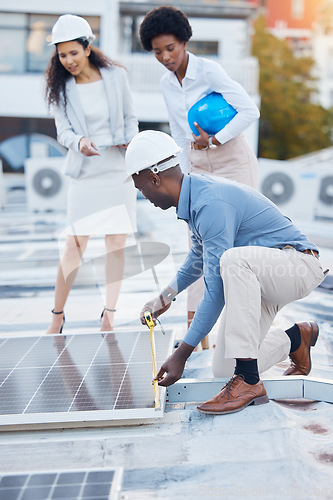 Image of Black man, roof and solar panel installation team of construction worker technician outdoor. Businessman, renewable energy and industrial eco friendly panels of maintenance employee and handyman