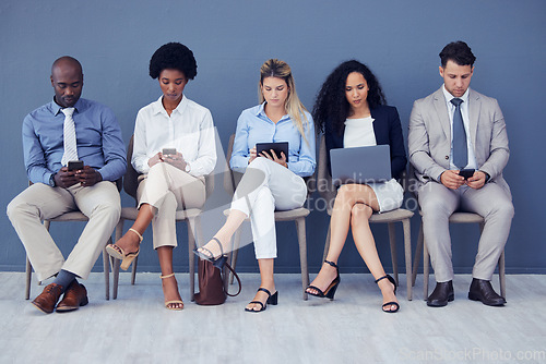 Image of HR, technology and business people waiting in line for an interview during the recruitment process. Resume, diversity or hiring with a man and woman employee group sitting in a human resources row