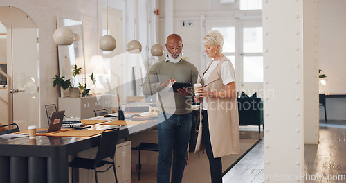 Image of Senior, executive and team with tablet and communication, collaboration and business discussion with mature business people in office. Black man, woman and workplace and coworking with management.