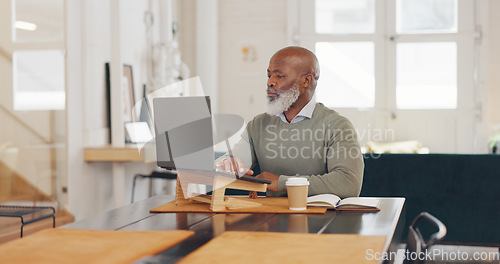 Image of Laptop typing, black man and remote work in living room, lounge and work from home office for planning, internet research or technology. Mature freelancer, computer and thinking while reading email