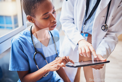 Image of Tablet, black woman or doctors planning surgery in conversation about medical news or tests results in hospital. Teamwork, digital or nurses speaking of online healthcare report or website research