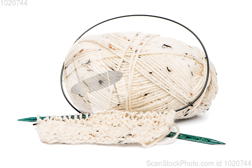 Image of Beige knitting wool with needles