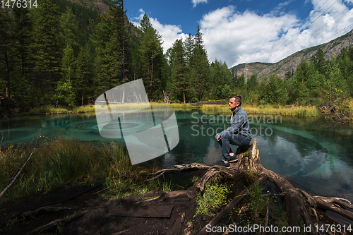 Image of Man at Beautiful Geyser lake