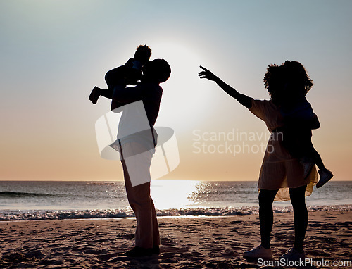 Image of Sunset silhouette, beach and family play, bond or enjoy quality time together for vacation love, holiday peace or freedom. Ocean sea water, nature travel shadow or fun nature people in Toronto Canada