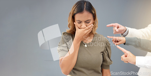 Image of Bullying, pointing and hands with business woman for mistake, shame and betrayal in workplace. Guilty, wall background and upset girl with fingers point for blame, negative judgement and conflict