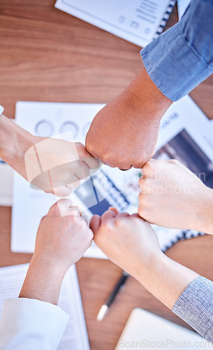 Image of Fist bump, solidarity and above of business people hands for motivation, partnership and support. Meeting, teamwork and employees with fists for unity, collaboration and team building at a seminar