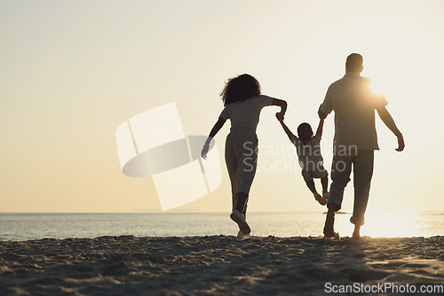 Image of Silhouette, mockup and a family on a beach, playing while having fun together by the ocean or sea. Kids, travel or love with a mother, father and child on the sand at sunset to play while bonding