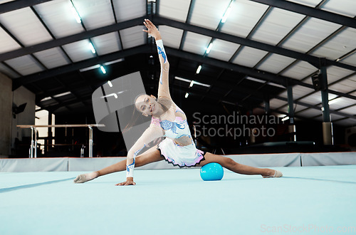 Image of Portrait, gymnastics performance and woman exercise, training or workout in gym. Sports fitness, pro gymnast and happy female athlete or acrobat practice, exercising and performing for competition.