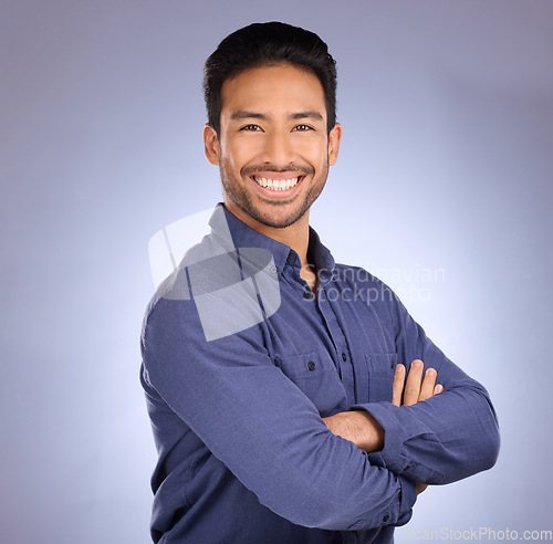 Image of Business man, consultant smile and portrait of staff from the Philippines in studio. Isolated, blue background and proud and confident businessman and entrepreneur ready for professional working