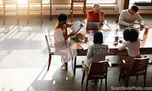 Image of Planning, teamwork people and startup meeting of creative strategy, digital project management and design ideas. Productivity, brainstorming and business or office team working on portfolio on top