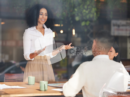 Image of Management, meeting or presentation with a business black woman talking to her team through an office window. Training, coaching or agenda with a female employee speaking to a colleague group at work