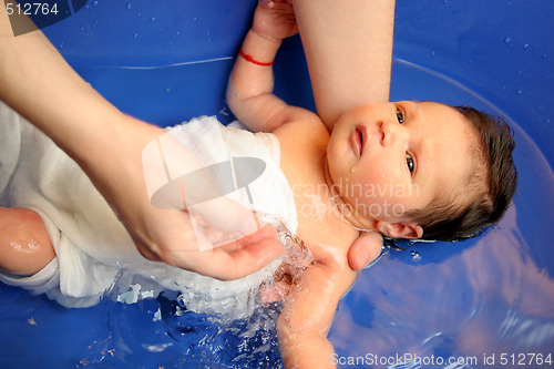 Image of A baby girl in a bathtub