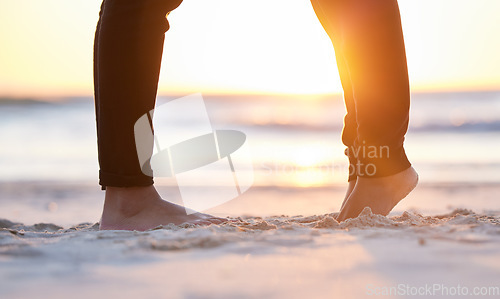 Image of Couple at beach, legs and feet in sand with sunrise, love and commitment in relationship with travel. Adventure together, trust and respect, care in partnership and people, ocean with holiday in Bali