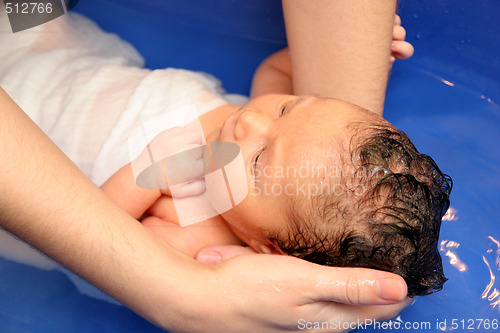 Image of baby girl in a bathtub