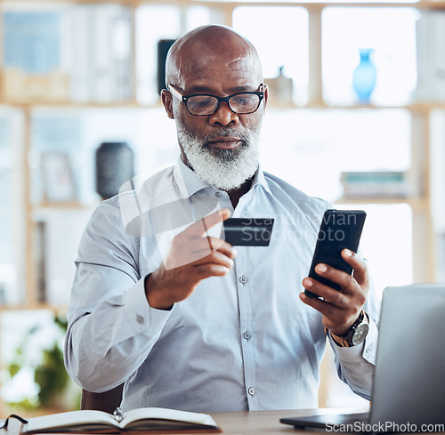 Image of Black man, credit card or phone for finance management, insurance policy or investment payment in corporate office. Serious, mature or CEO businessman on bank app, mobile technology or online fintech