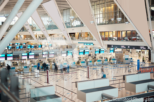 Image of Busy, moving and people in an airport for travel, check in and departure. Building, speed and crowd walking, moving and arriving or leaving for a trip, holiday or traveling for work or vacation