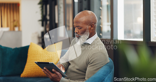 Image of Tablet, technology and senior black man on sofa browse online website, social media and internet. Online shopping, retirement and elderly male enjoy freedom, weekend and relax with digital tech