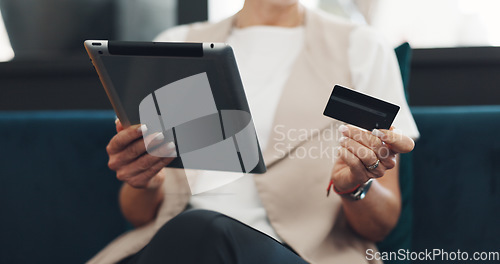 Image of Woman, tablet and credit card for ecommerce, online shopping and paying bills while on a couch reading details or information for payment. Hands of female doing online banking with wifi network