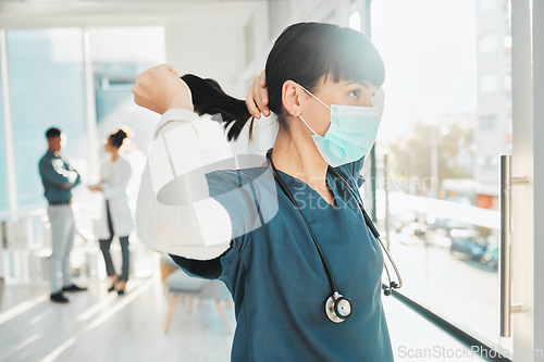 Image of Covid, window and doctor at a hospital for healthcare, medical work and thinking. Idea, hair care and nurse wearing a face mask for a virus while working at a clinic, looking at view and medicare