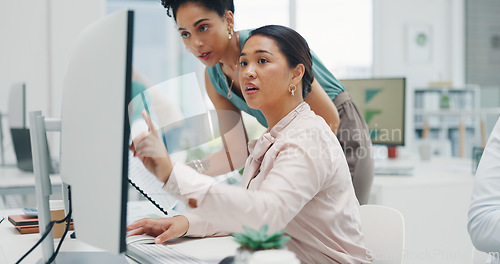 Image of Finance, documents and collaboration with a business black woman talking to a colleague in the office. Teamwork, planning and strategy with a graph or chart on a computer screen at work