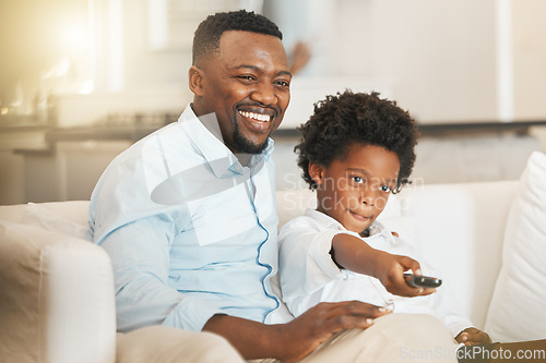 Image of Black family, sofa and father with boy with remote for tv channel, streaming movies and watching film. Love, home and happy dad with child with television control for entertainment, cartoon and relax